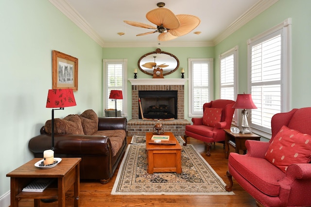 living room with plenty of natural light, wood-type flooring, and ornamental molding