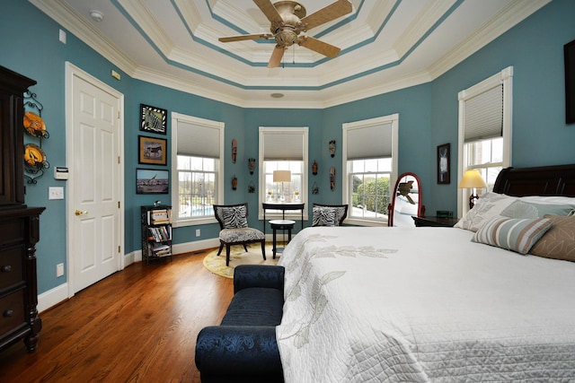 bedroom with multiple windows, ceiling fan, dark hardwood / wood-style flooring, and crown molding