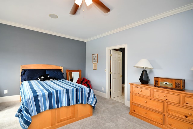 carpeted bedroom featuring ceiling fan and ornamental molding