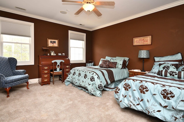 bedroom featuring ceiling fan, ornamental molding, and multiple windows