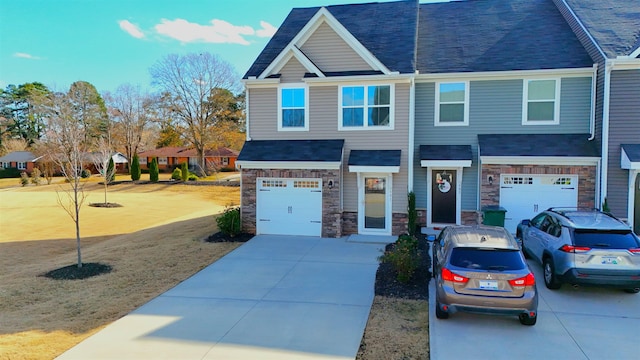 view of front of house featuring a garage and a front lawn