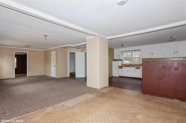 unfurnished room featuring crown molding