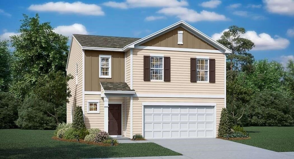 view of front of house with a front yard and a garage