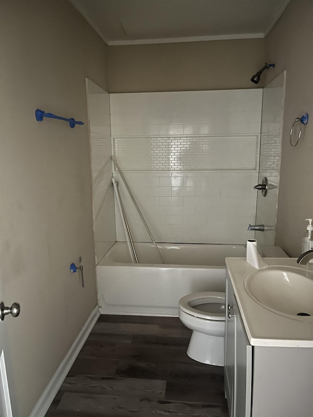 full bathroom featuring vanity, crown molding, toilet, shower / bathtub combination, and wood-type flooring