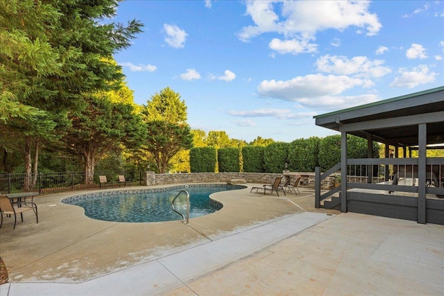 view of pool featuring a patio