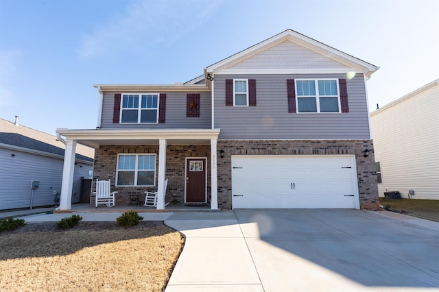 view of front facade with driveway, a porch, an attached garage, and brick siding