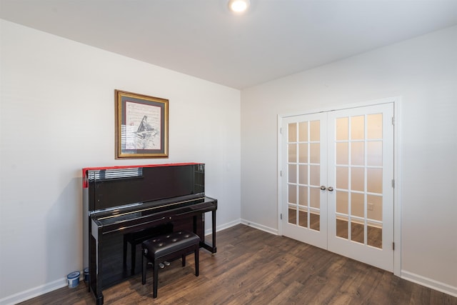 sitting room featuring french doors, wood finished floors, and baseboards