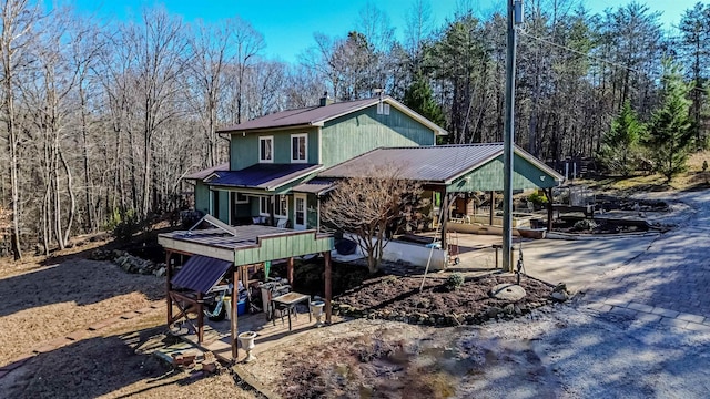 back of house with a patio