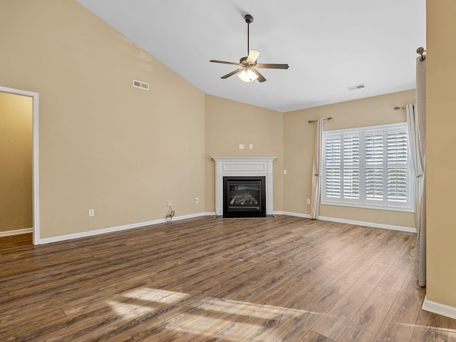 unfurnished living room featuring hardwood / wood-style floors, vaulted ceiling, and ceiling fan