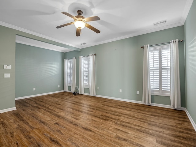 empty room featuring hardwood / wood-style flooring, ceiling fan, and ornamental molding