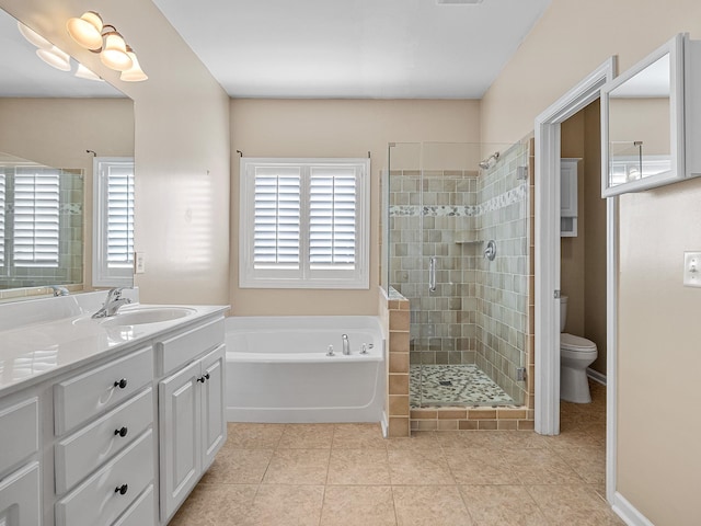 full bathroom with plus walk in shower, vanity, toilet, and a healthy amount of sunlight