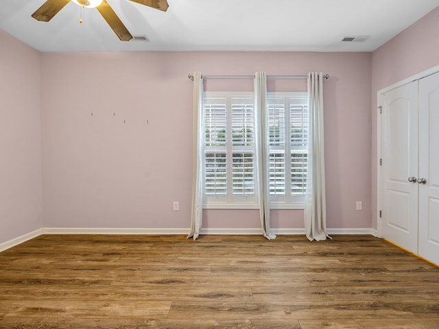 unfurnished bedroom with wood-type flooring and ceiling fan