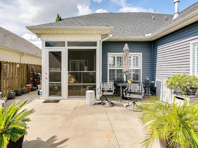 view of patio with a sunroom