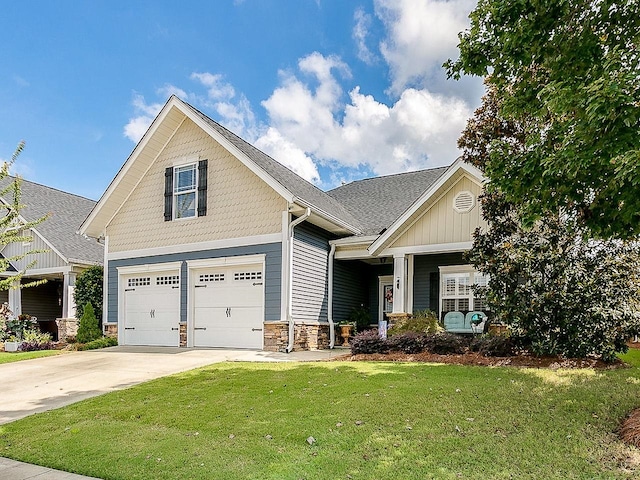 craftsman-style home with a front lawn and a garage