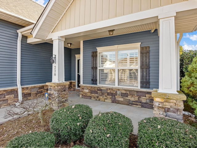 view of exterior entry featuring a porch