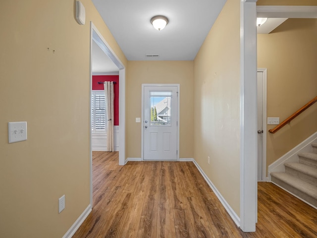 entryway with wood-type flooring