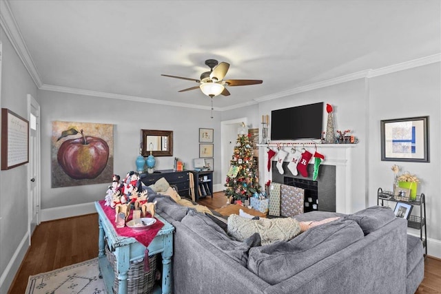 living room featuring hardwood / wood-style flooring, ornamental molding, and ceiling fan