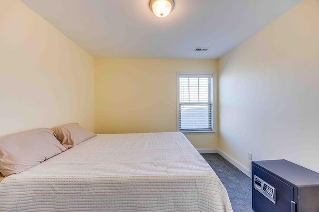 bedroom with dark carpet