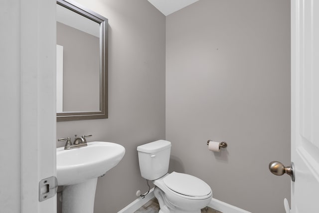 bathroom with sink and toilet