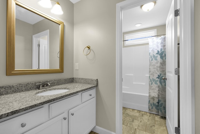 bathroom with vanity and shower / bath combo with shower curtain