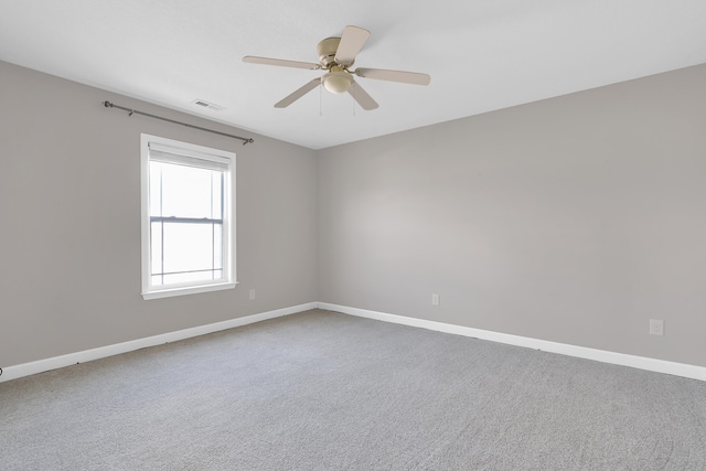 carpeted empty room with ceiling fan