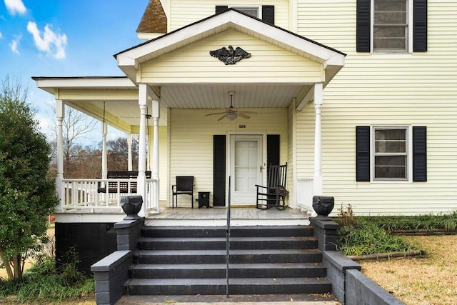 doorway to property featuring ceiling fan and covered porch