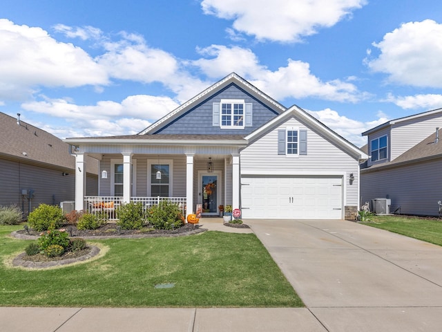 view of front facade with central air condition unit, a front lawn, a porch, and a garage