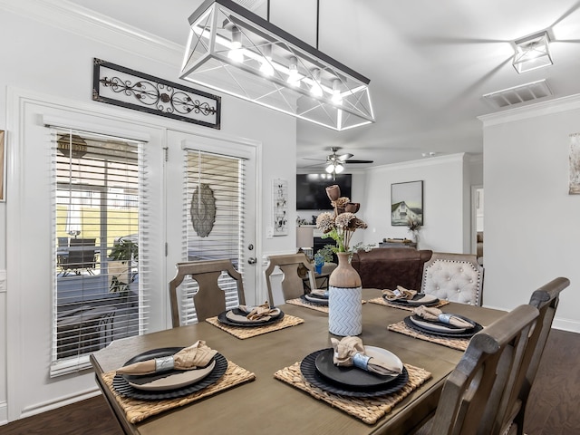 dining space with hardwood / wood-style floors, ceiling fan, and ornamental molding