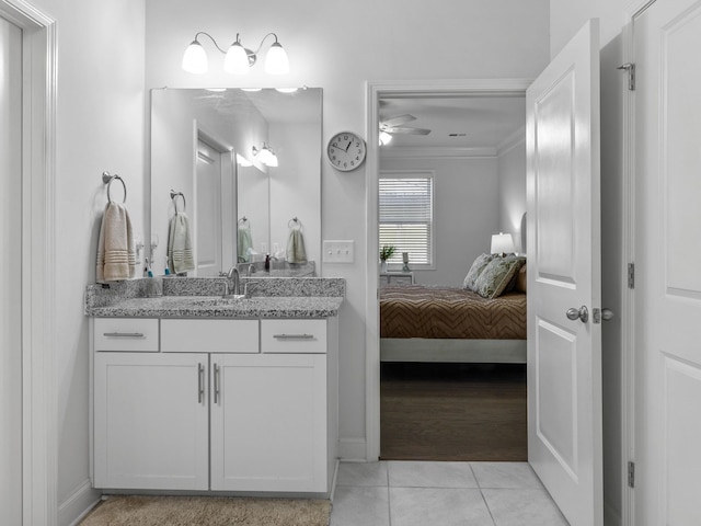 bathroom with vanity, crown molding, tile patterned flooring, and ceiling fan