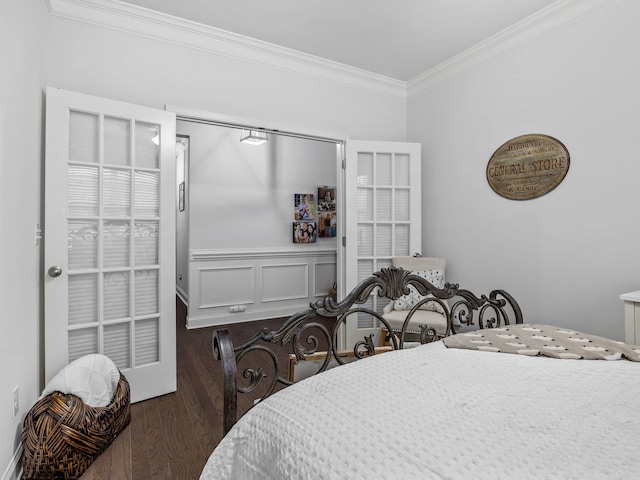 bedroom featuring crown molding and dark wood-type flooring