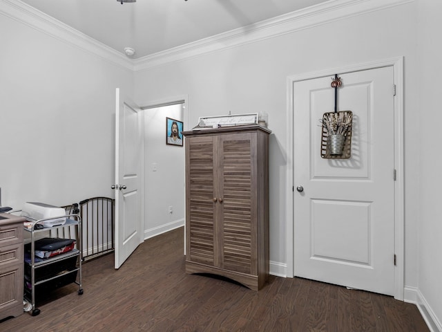 bedroom with crown molding and dark hardwood / wood-style floors