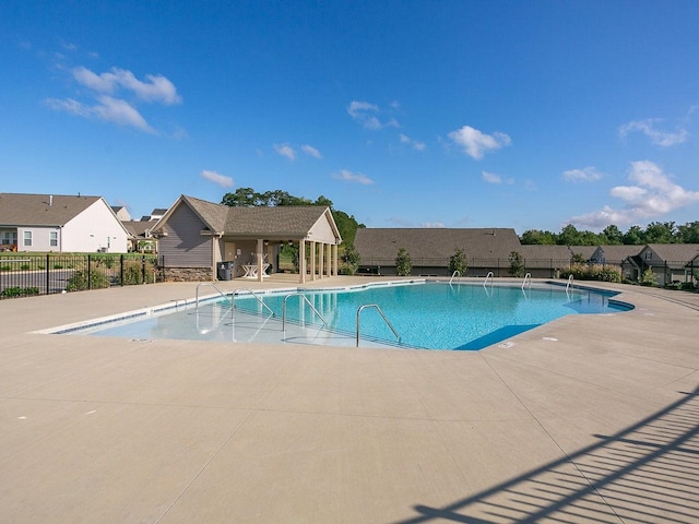 view of swimming pool with a patio area