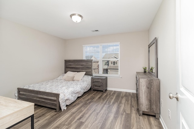 bedroom featuring dark wood-type flooring