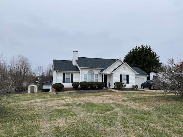 ranch-style house featuring a front yard and a garage