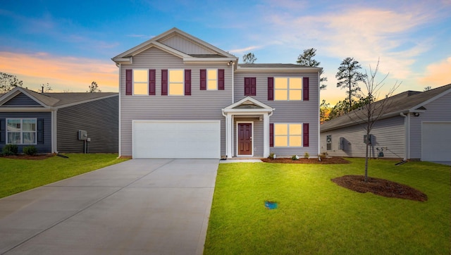 view of front of house with a lawn and a garage