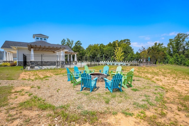 view of yard with a fire pit