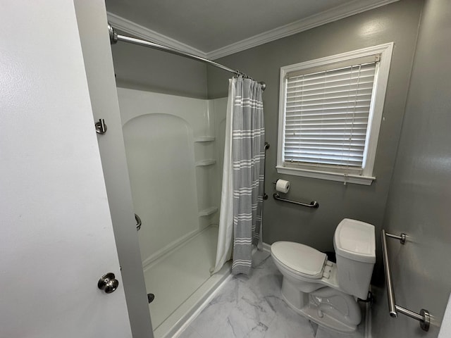 bathroom with crown molding, toilet, and a shower with shower curtain