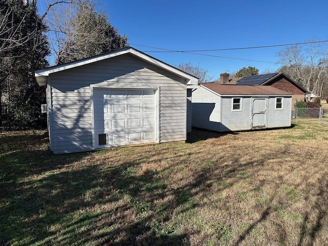 garage featuring a yard