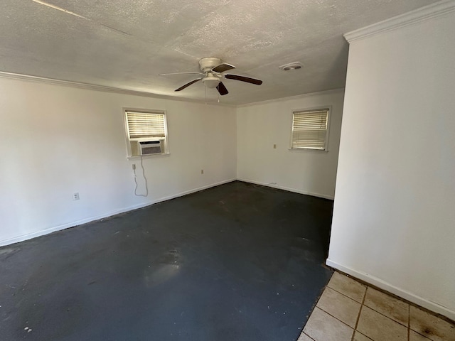 tiled spare room featuring a textured ceiling, cooling unit, ceiling fan, and crown molding