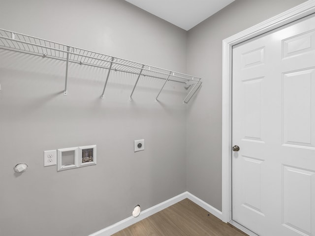 laundry room with electric dryer hookup, washer hookup, and hardwood / wood-style flooring