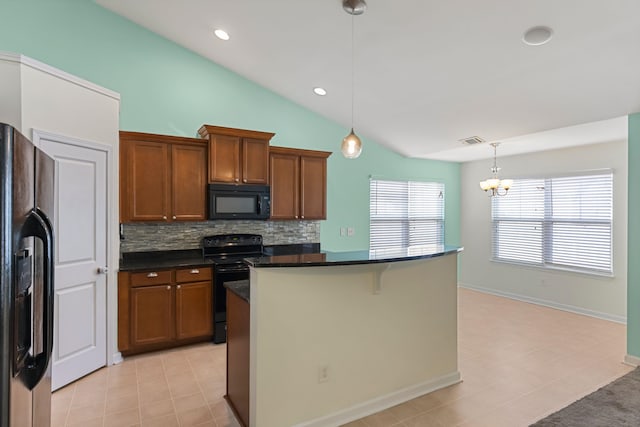 kitchen with backsplash, black appliances, a center island, hanging light fixtures, and a breakfast bar area