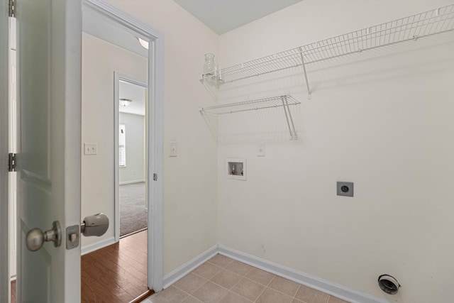 clothes washing area featuring washer hookup and electric dryer hookup