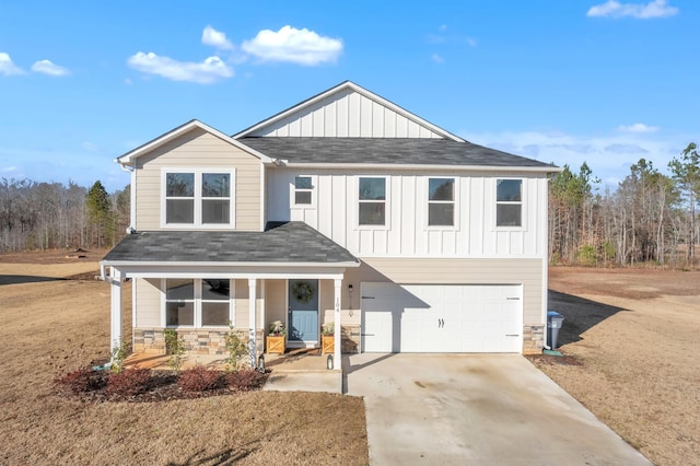 view of front of house featuring a garage and a front yard