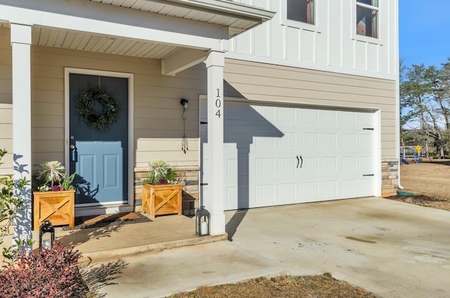 view of exterior entry with a garage