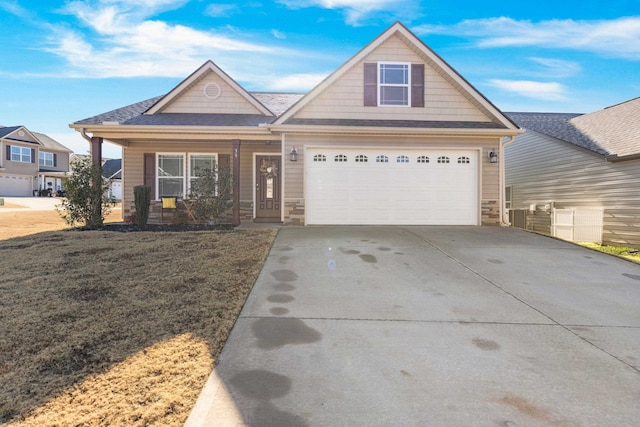 craftsman-style home with a garage and a front lawn