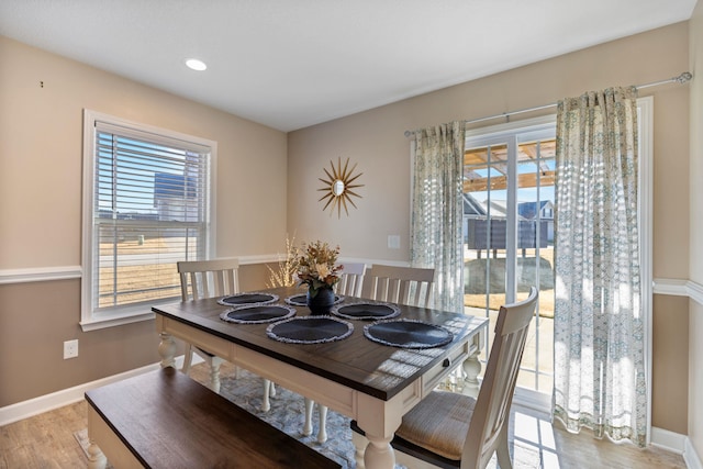 dining space with light hardwood / wood-style flooring