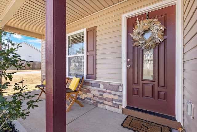 property entrance featuring covered porch