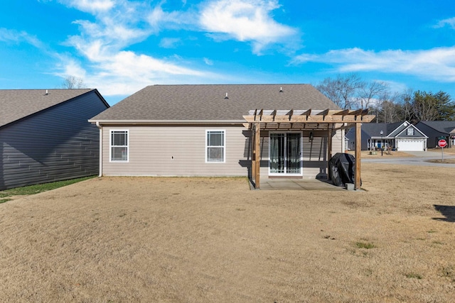 back of property featuring a pergola and a patio area