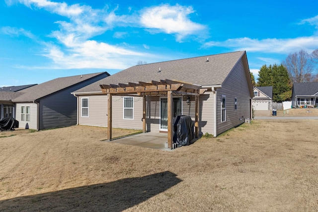 back of property with a pergola and a patio