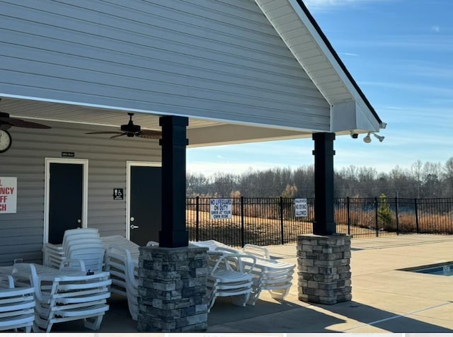 view of patio / terrace featuring a gazebo and ceiling fan